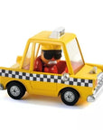 Sárga játék taxi autó figurával, fekete-fehér kockás díszítéssel, gyerekjáték