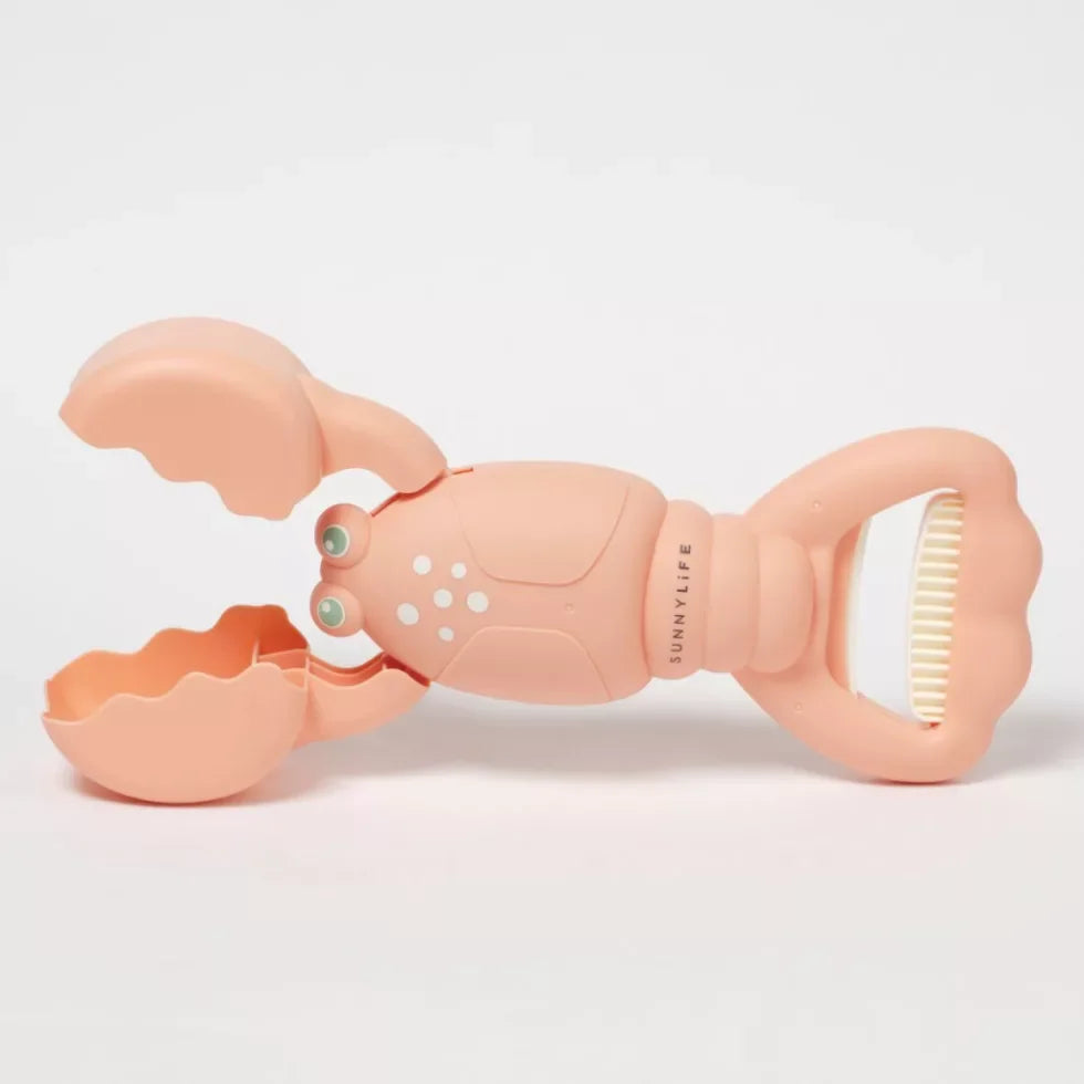 Rózsaszín műanyag homár alakú gyerek játék homokozóhoz, mozgatható ollóval.